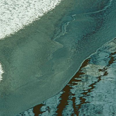 Image showing a pattern of repeating, gentle waves in sand.